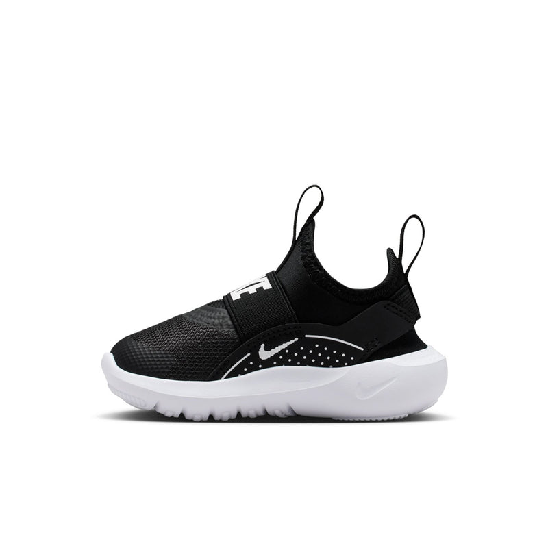 Black toddler slip-on sneaker with dotted Nike swoosh and adjustable strap