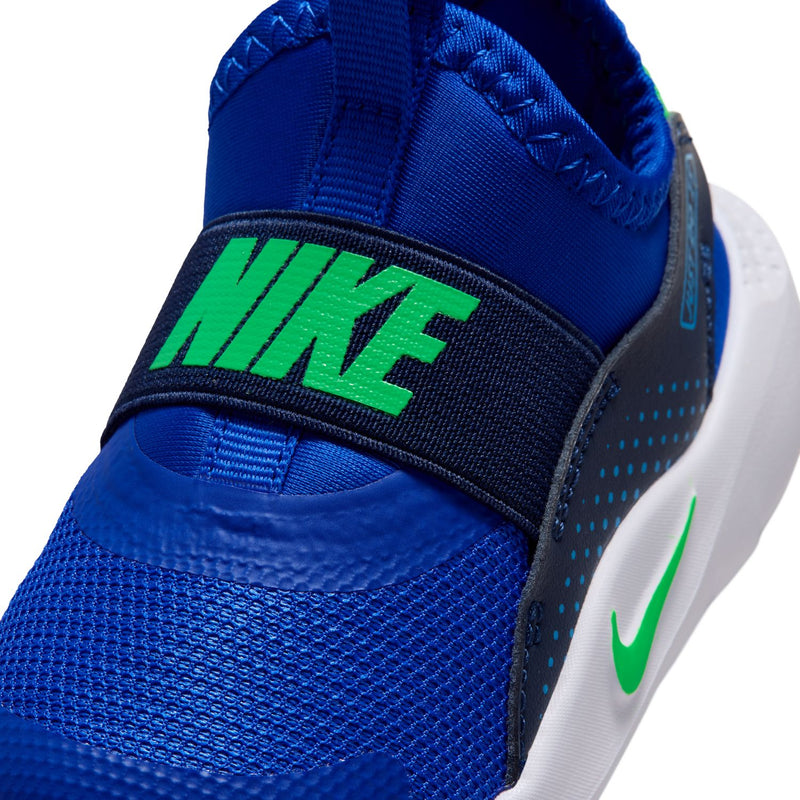 Close-up toddler blue strap with green NIKE logo and white sole edge