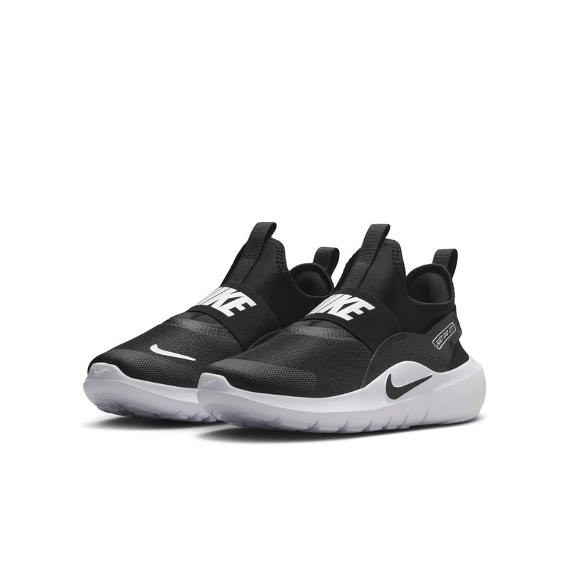 Youth black slip-on sneaker, side view with white swoosh and sculpted sole