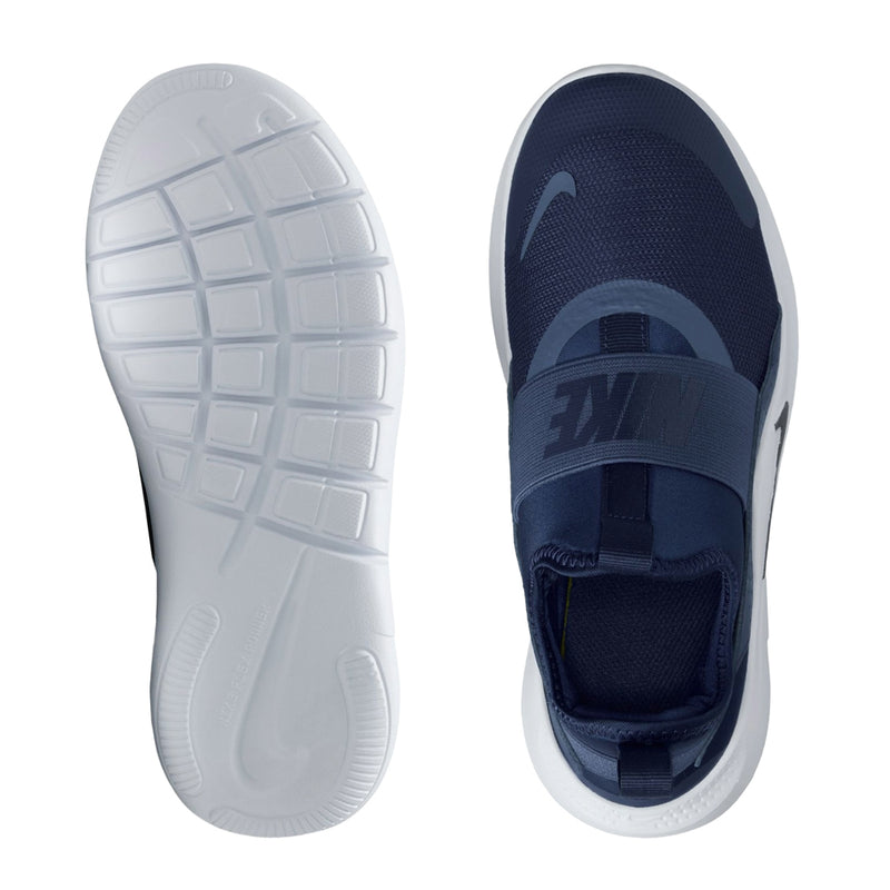 Youth navy and white sneakers showing treaded outsole and side view, Nike logo.