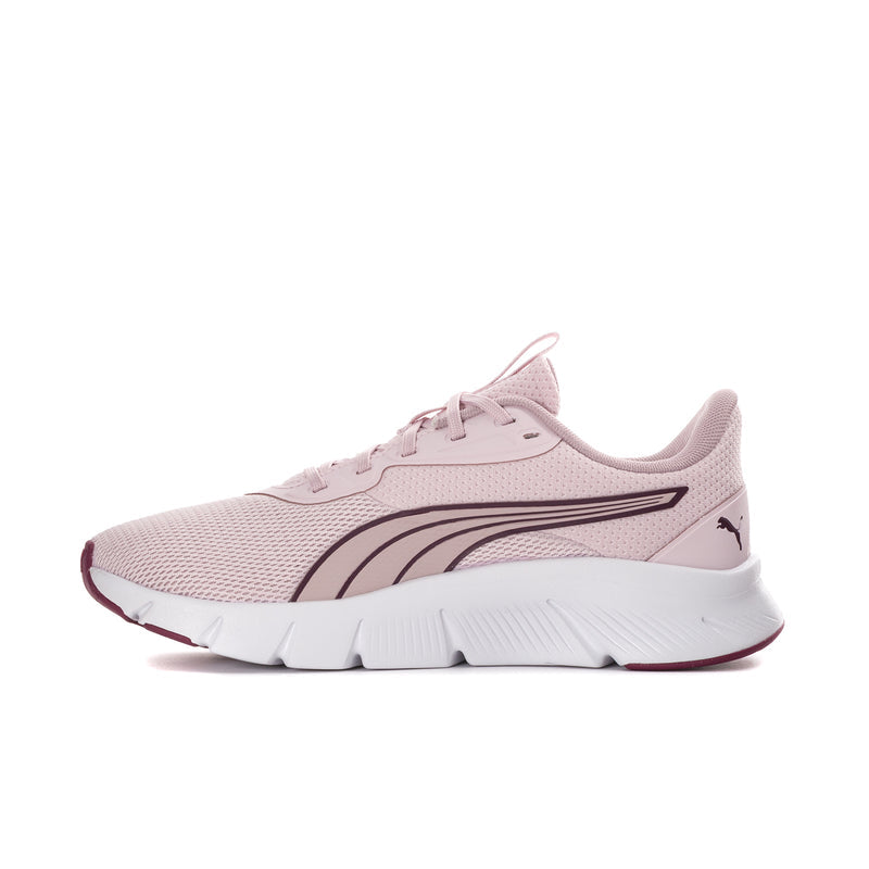 Light pink women's running sneakers with curved stripe detail and white cushioned sole