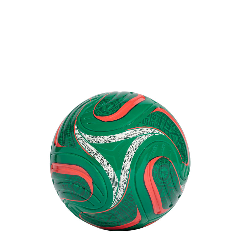 Green mini soccer ball with white patterns and orange accents