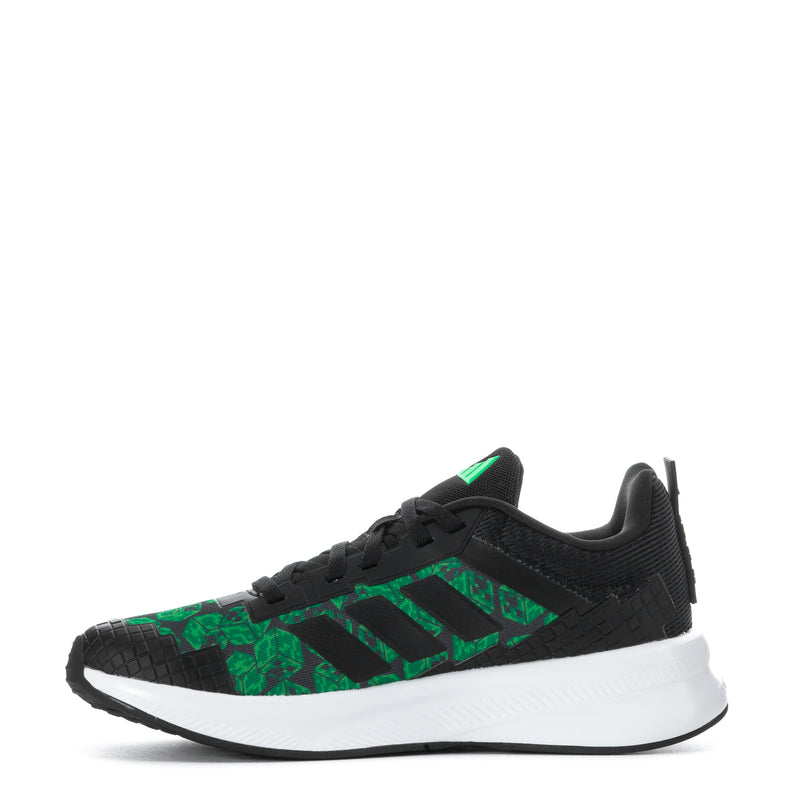 Youth sneakers side view, black with green patterned upper and white midsole