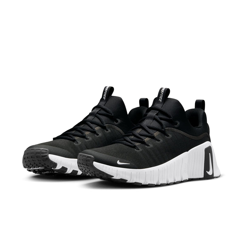 Men's black low-top sneakers with white side stripe and lace-up design