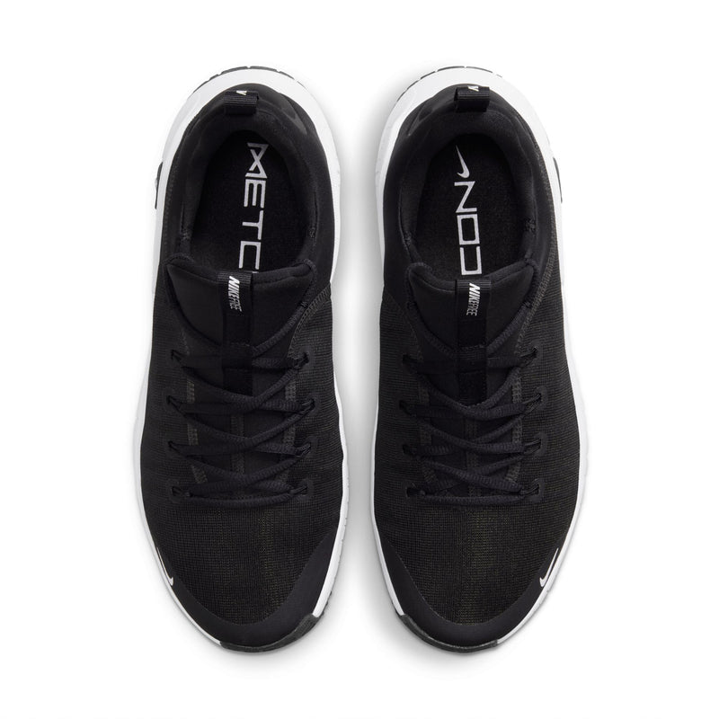 Pair of black men's sneakers with lace-up closure and white-trimmed soles