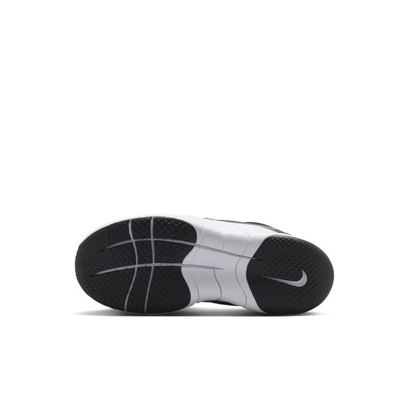 Kids' black outsole with tread and white side panels on sneaker