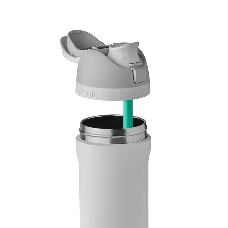 FreeSip 24 oz stainless steel bottle with teal straw and open lid for drinking.