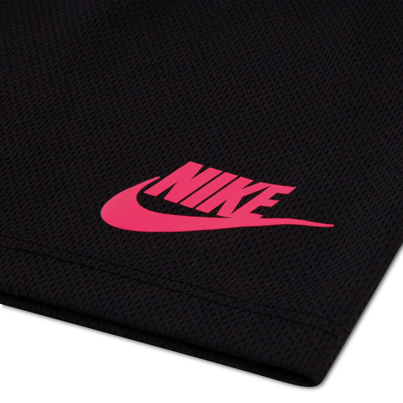 Black mesh shorts close-up: pink Nike logo on textured fabric