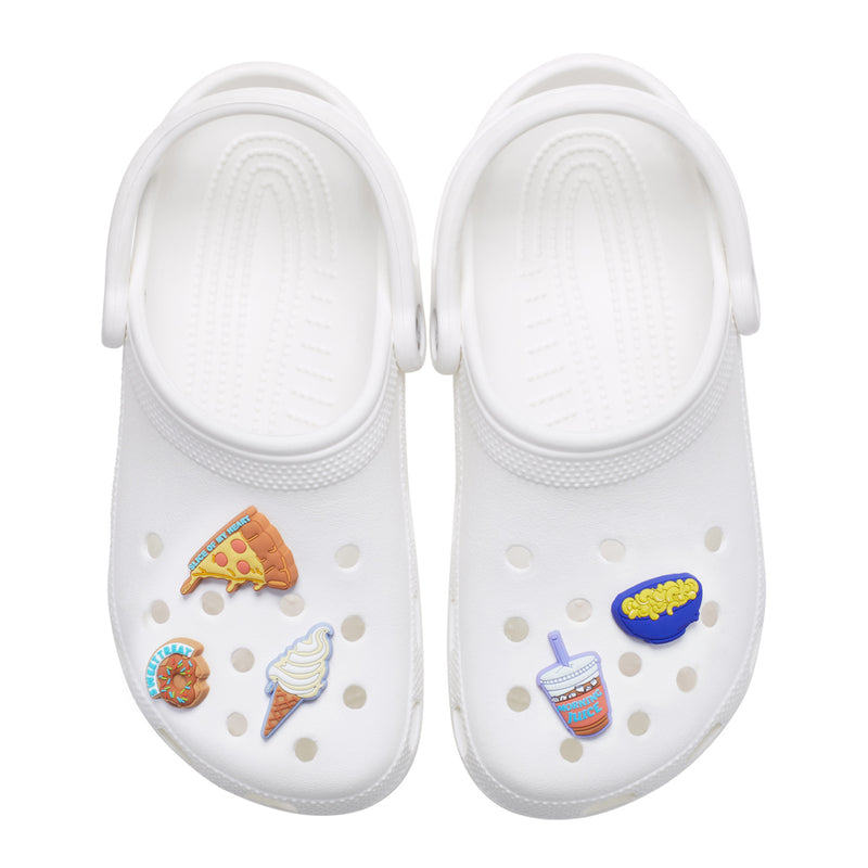 Set of multicolor food Jibbitz on white Crocs: pizza, fries cup, ice cream cone