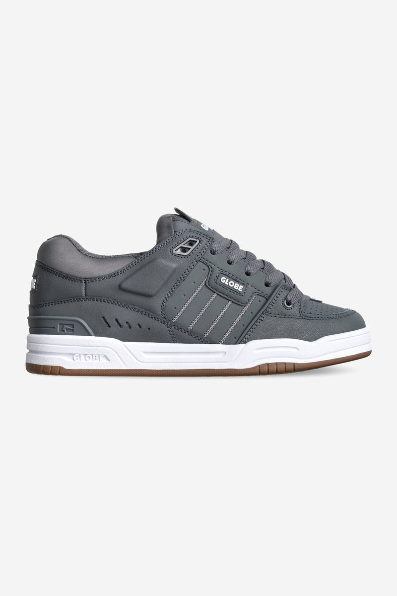Side view of charcoal Fusion skate shoe with white midsole and gum outsole