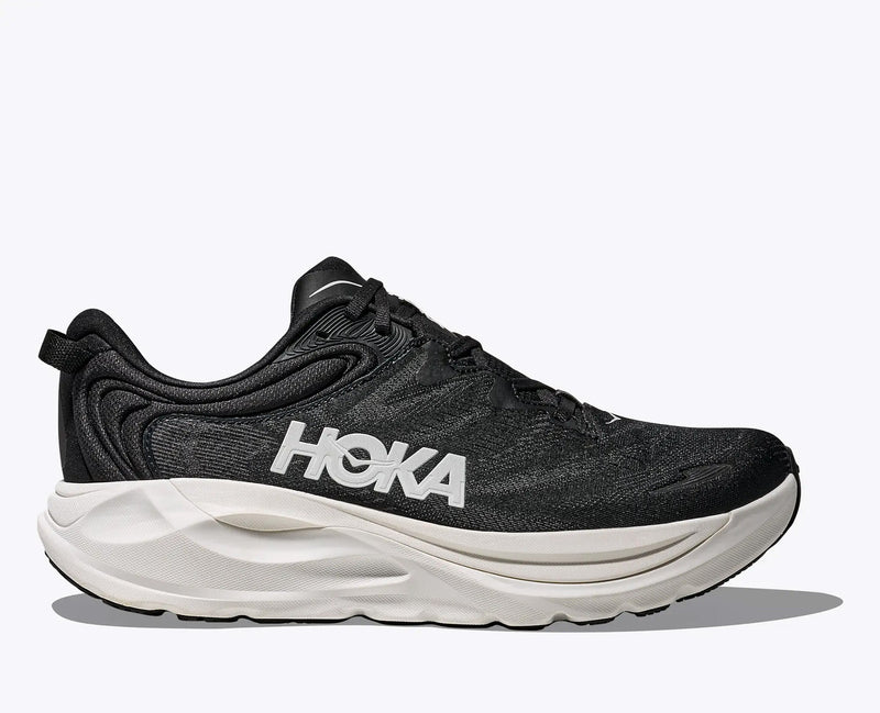 Quarter turn view Men's HOKA Footwear style name Gaviota 6 XWide in color Black/ White. Sku: 1171936-BWHT