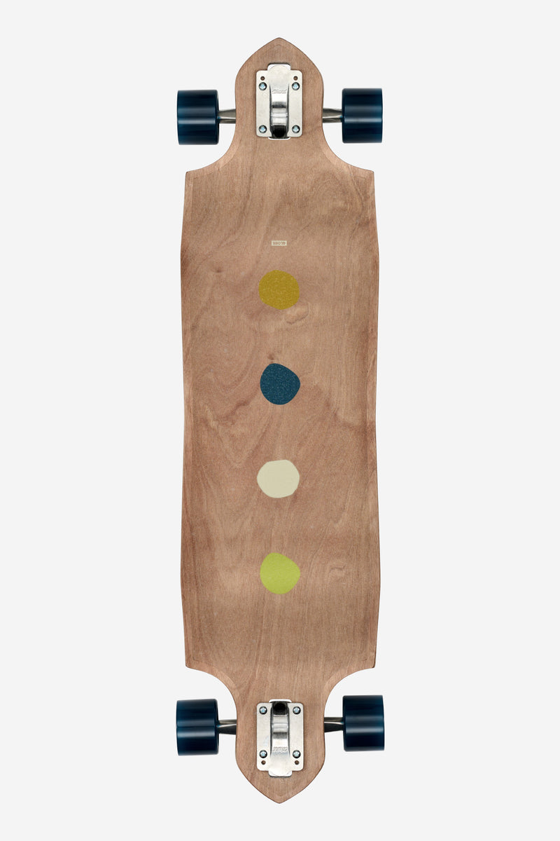 Top view of Geminon Micro-Drop Longboard Dawn showing natural maple deck with colored dots and blue wheels