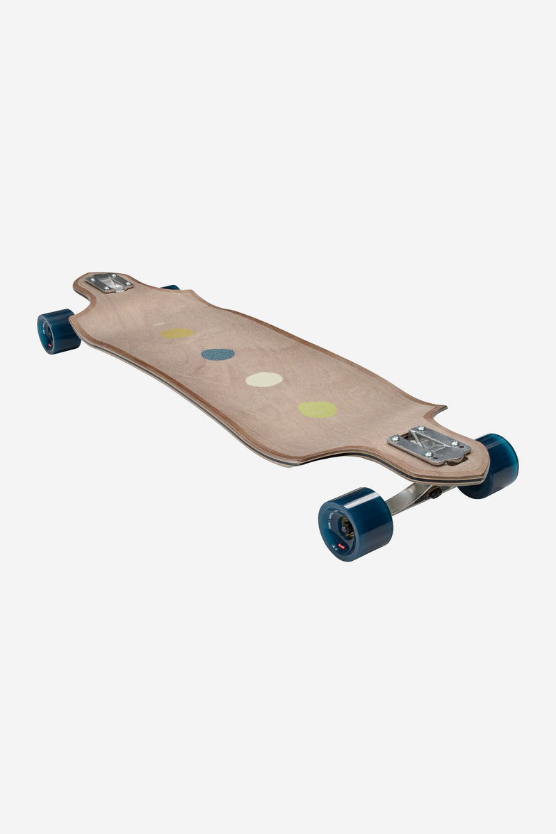 Three-quarter view of Geminon Micro-Drop Longboard Dawn with colorful dot graphic on maple deck and blue wheels