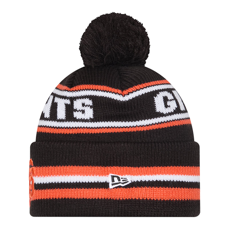 Black knit beanie with pom-pom, orange and white striped band, side Giants letters