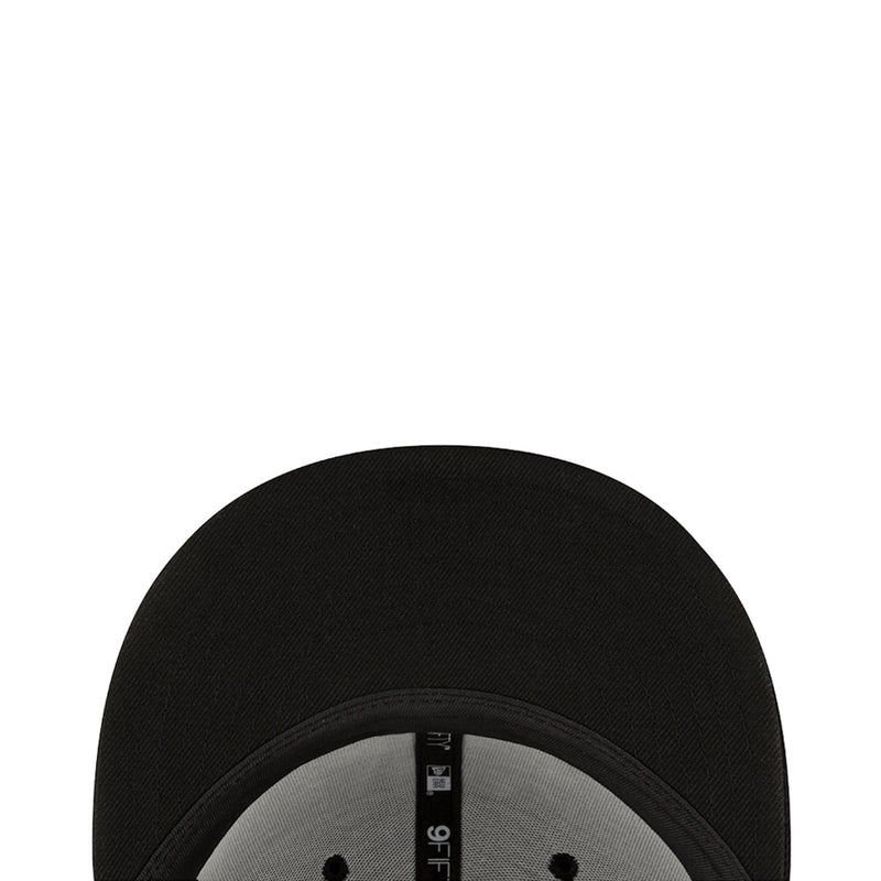 Black baseball cap close-up of gray underbrim and inner brand label