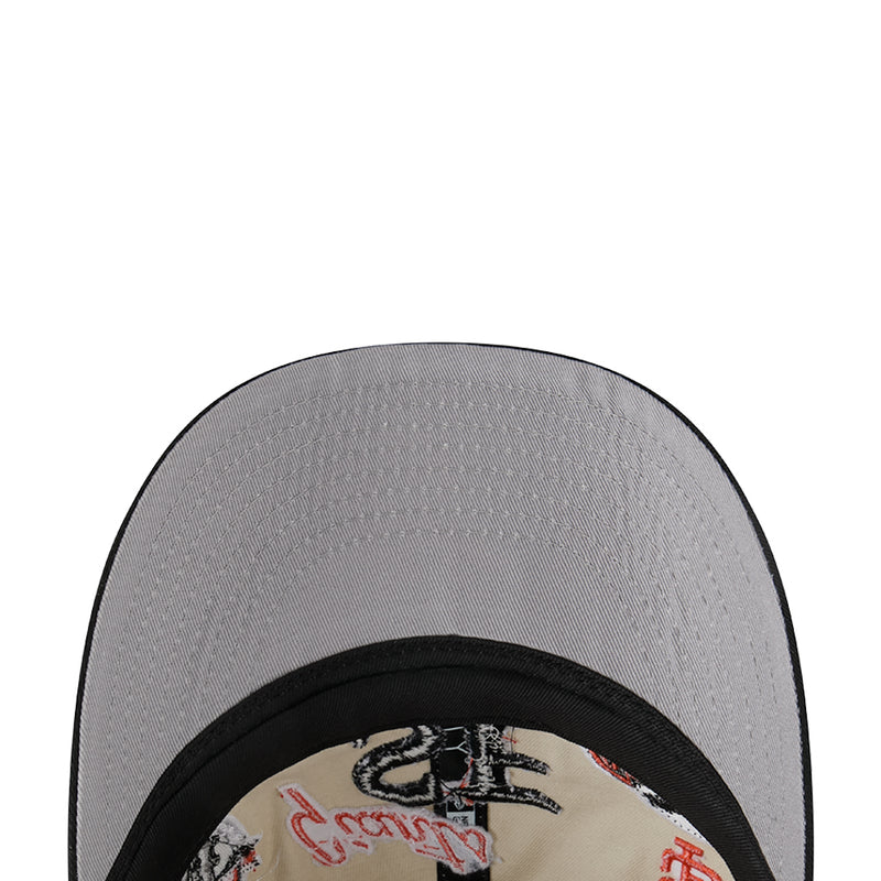 Two-tone baseball cap top view, grey crown with black brim trim and logo patch