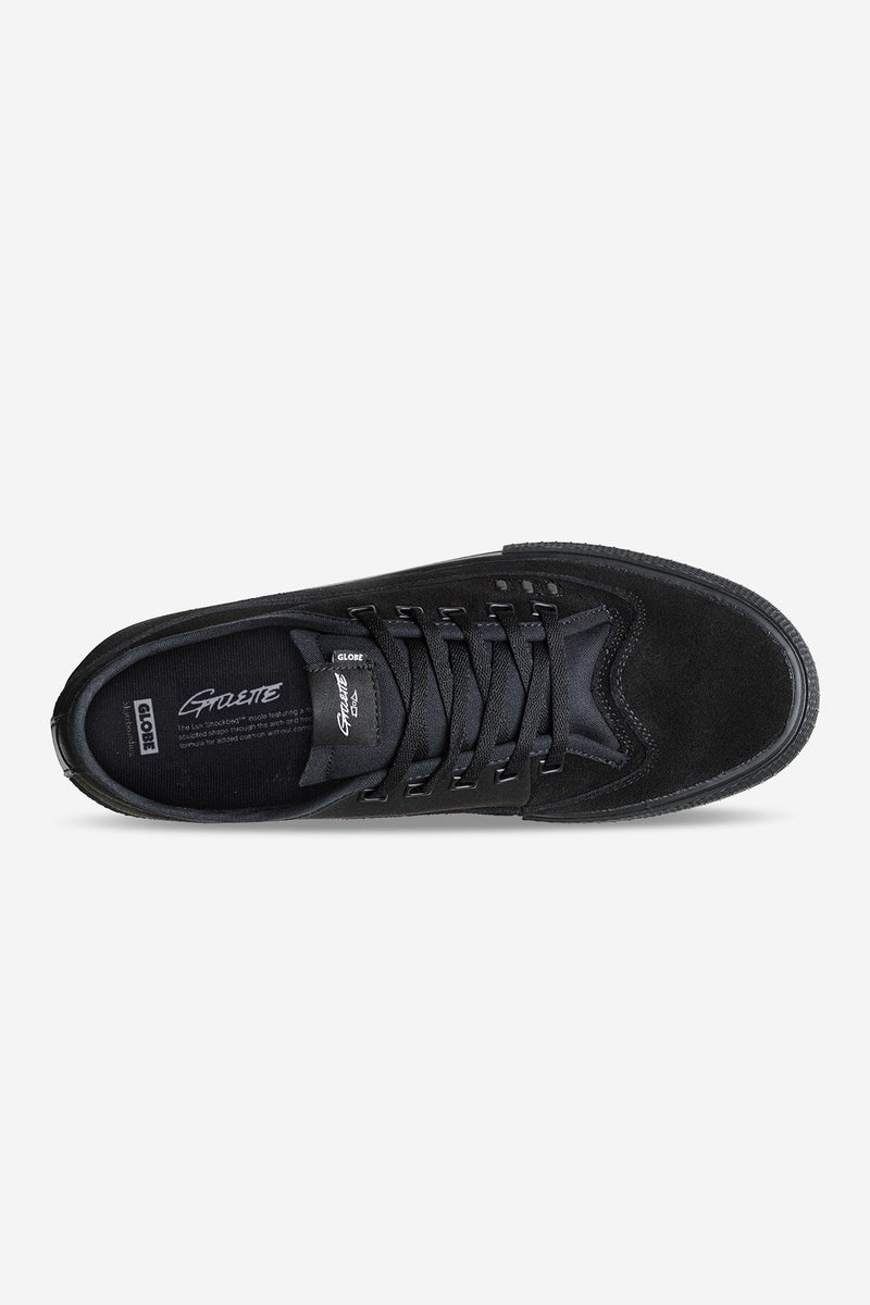 Top view of black suede Globe Gillette sneaker with laces and a Globe logo on the tongue