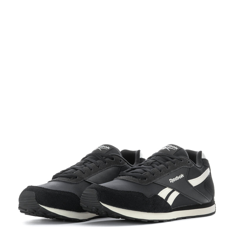 Pair of women's black low-top sneakers with white accents and Reebok branding