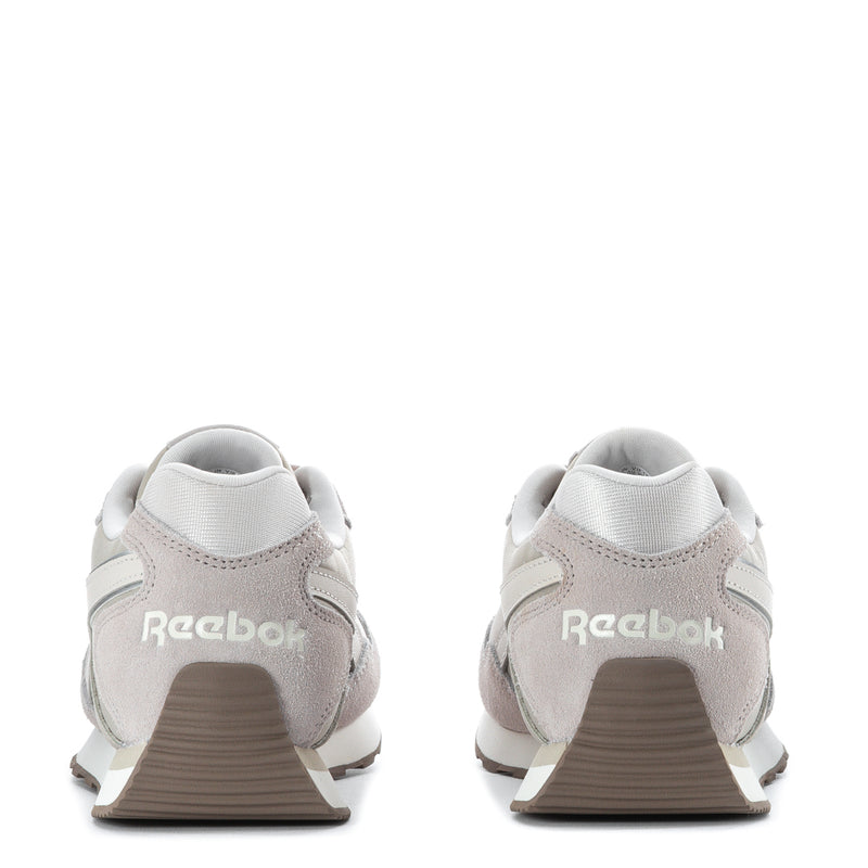 Women's sneaker heel view, light grey/beige suede with Reebok logo on back