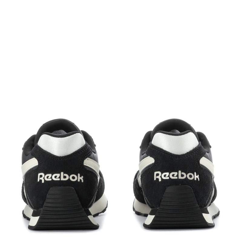 Women's black low-top sneakers with Reebok heel logo and white heel panel
