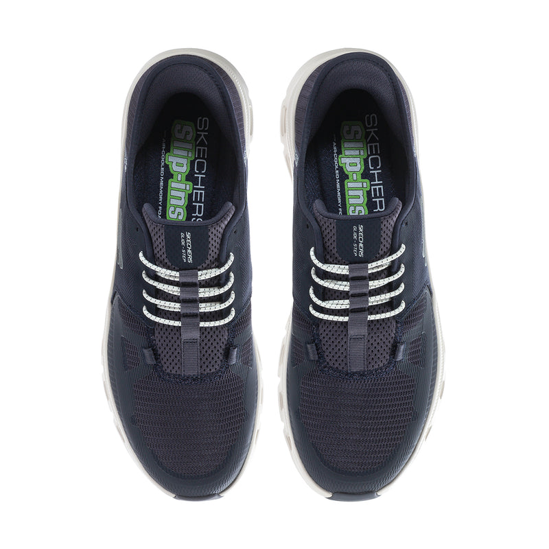 Men's navy sneakers showing interior lining and lace-up pattern across tongues.