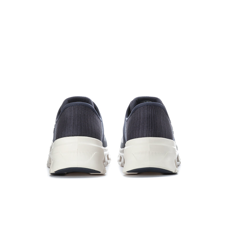 Men's navy sneakers with white heel counters and rear cushioned platform sole.