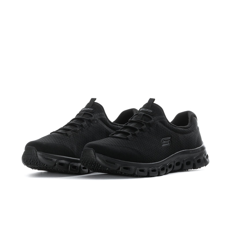 Women's black slip-resistant wide sneakers, angled view with grippy midsole pods