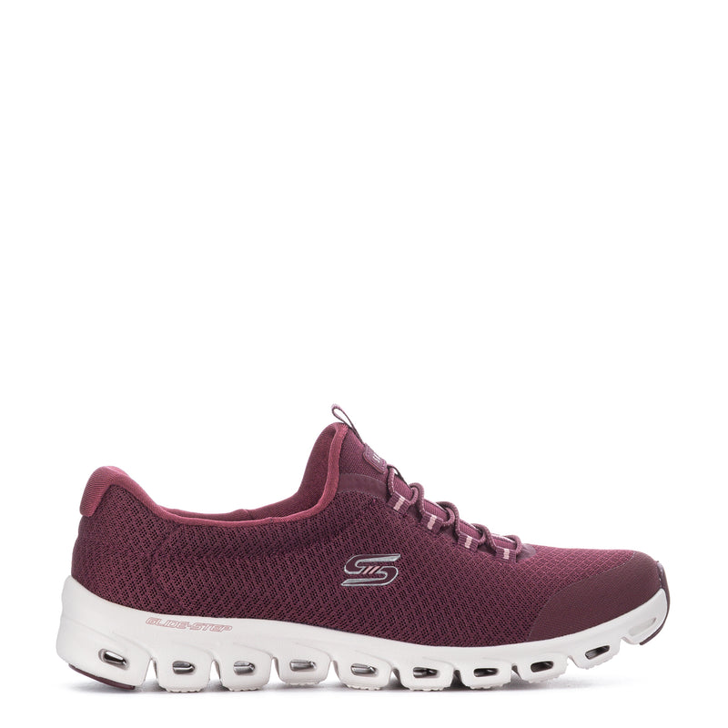 Burgundy knit lace-up women’s running shoe with white cushioned sole and tread pods
