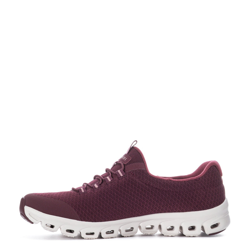 Burgundy lace-up running shoe, textured upper and white outsole with pod-like openings