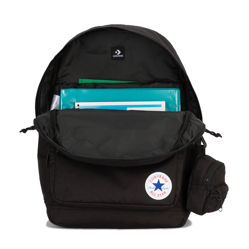 Black backpack with top open compartment and books inside, Converse All Star patch