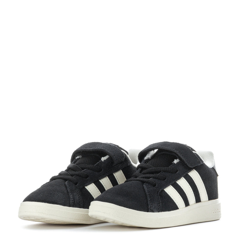 Pair of black toddler sneakers with white stripes and hook-and-loop strap