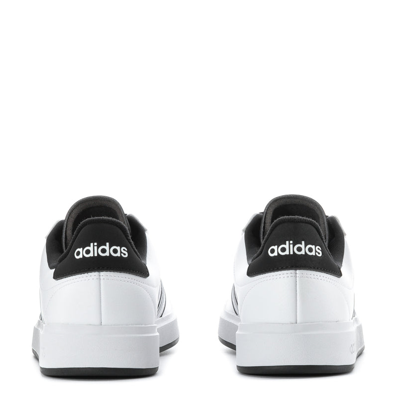 Men's white sneakers with black heel collar and adidas logo, viewed from the back