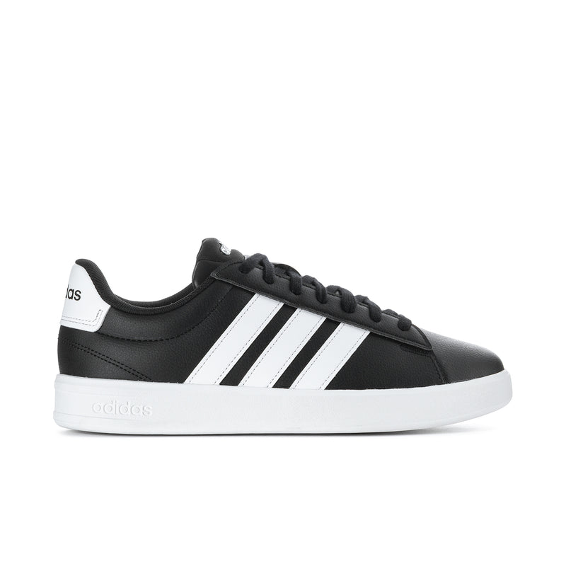 Men's black sneakers with white adidas stripes and black lace-up closure