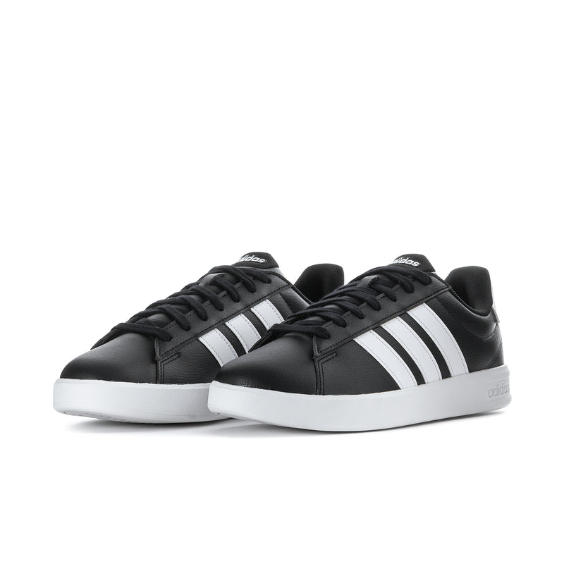Men's black adidas sneakers, two shoes shown, with white three-stripe details and laces