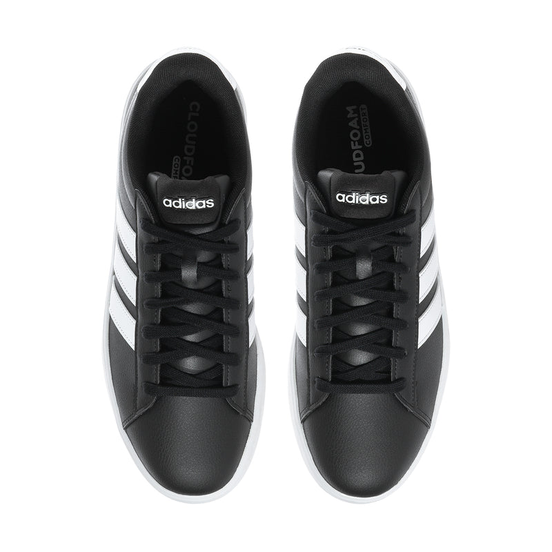 Men's black adidas sneakers with white side stripes; adidas logo on tongues