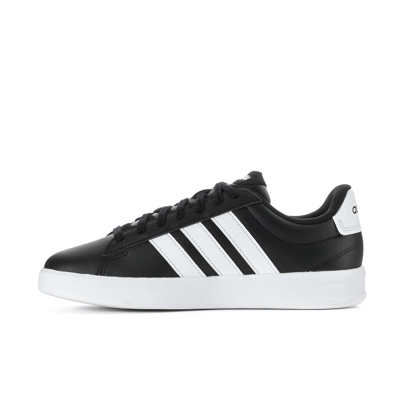 Men's black low-top sneakers with white adidas stripes and black laces