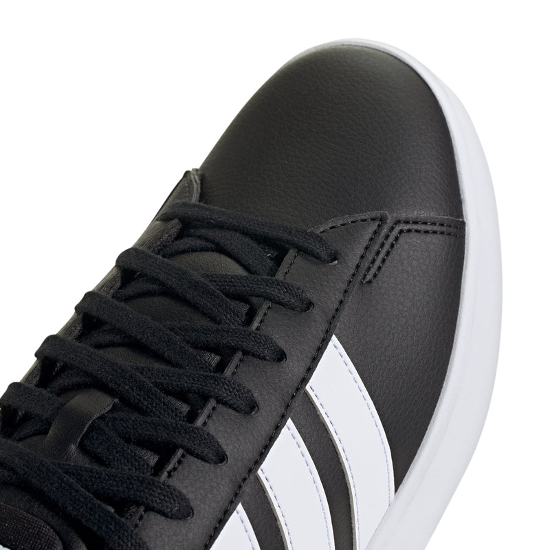 Black leather sneaker upper with black laces and white adidas side stripe