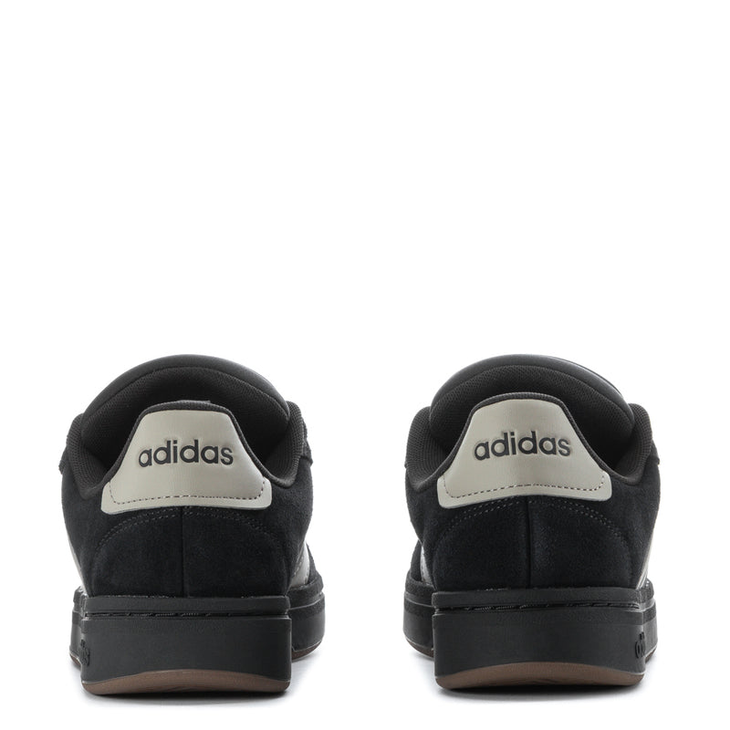 Back view of men’s black adidas court sneakers with heel branding and gum trim