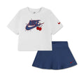 Kids' two-piece graphic set: white T-shirt with Nike scooter-cherry print, navy skort