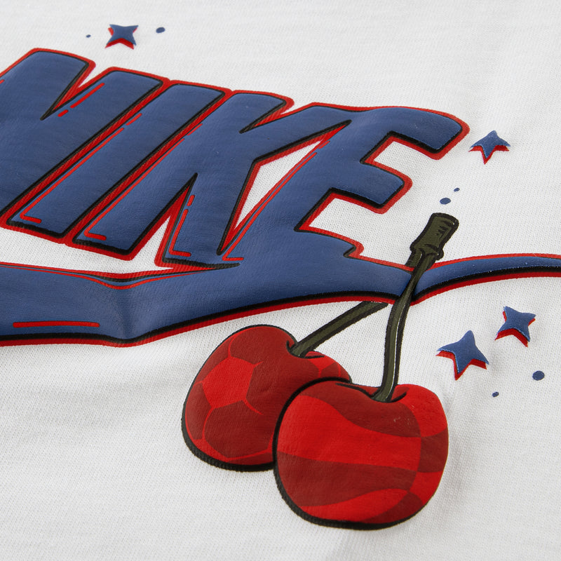 White T-shirt close-up: blue scooter word graphic with red cherries and stars