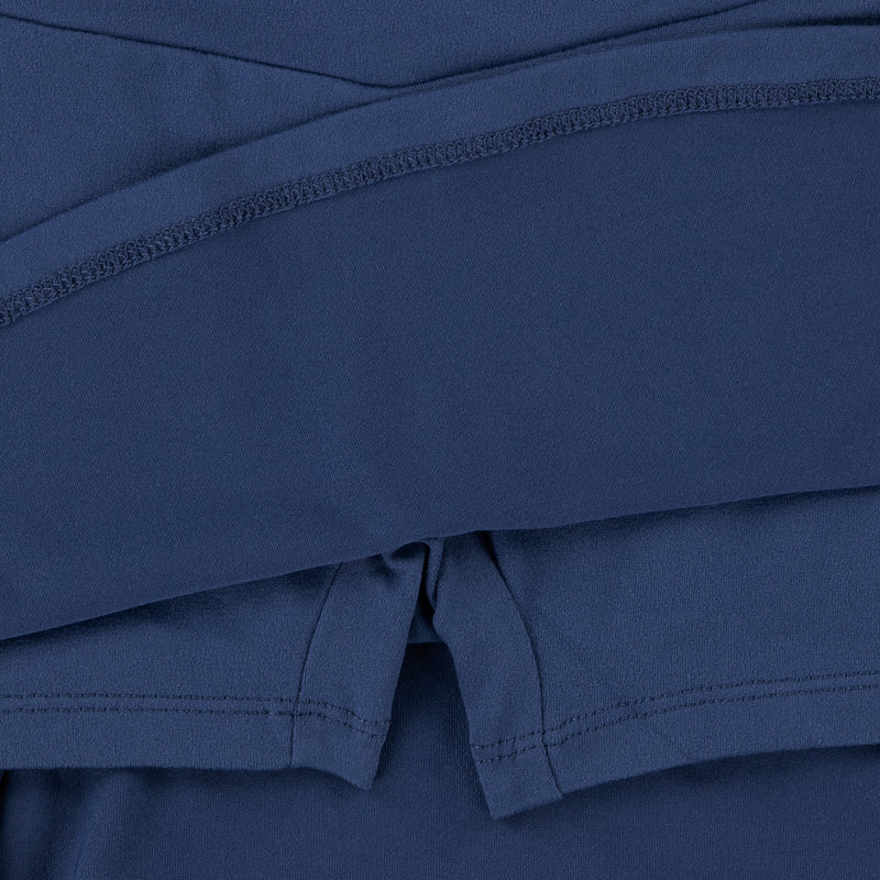 Navy skort close-up: elastic waistband and stitched hem with front tie detail