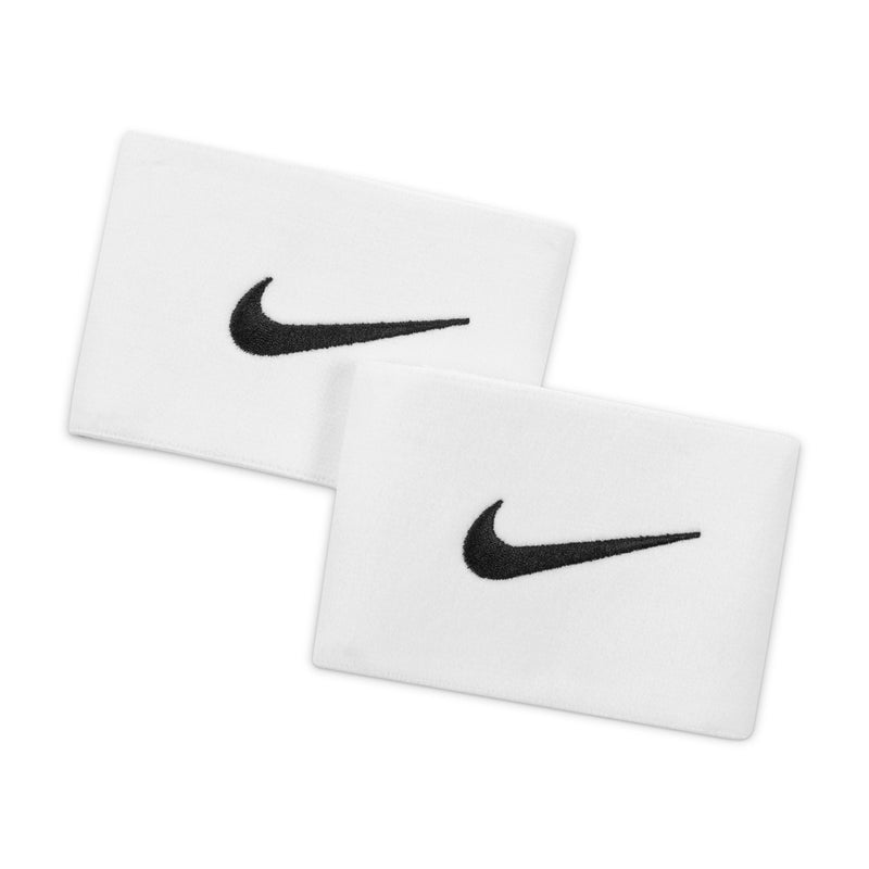 Pair of white sports guard stay pads with black Nike swoosh logo