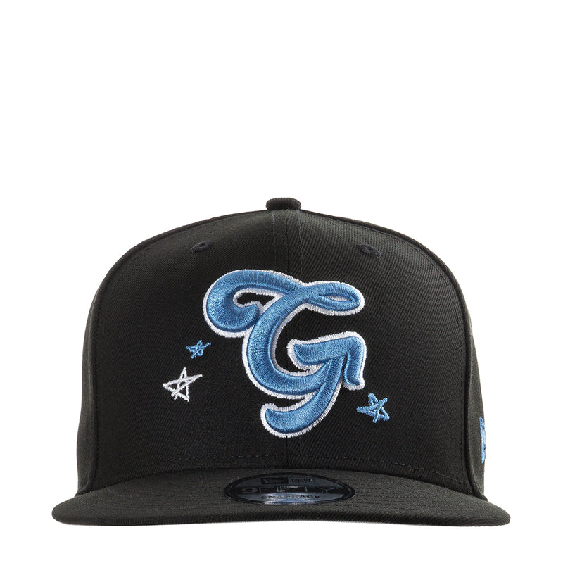 Black baseball cap with large blue letter G embroidery and small star accents