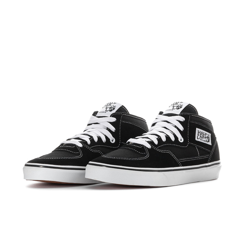 Black canvas high-top sneakers, side view, white laces and white midsole