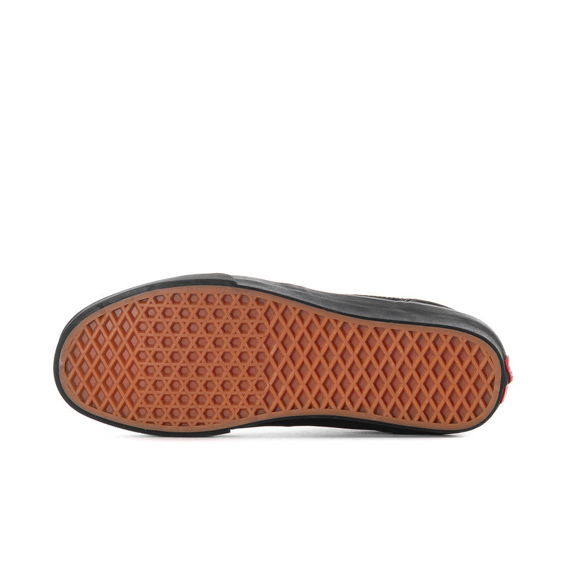 Men's black high-top sneaker outsole with textured brown tread and red side edge