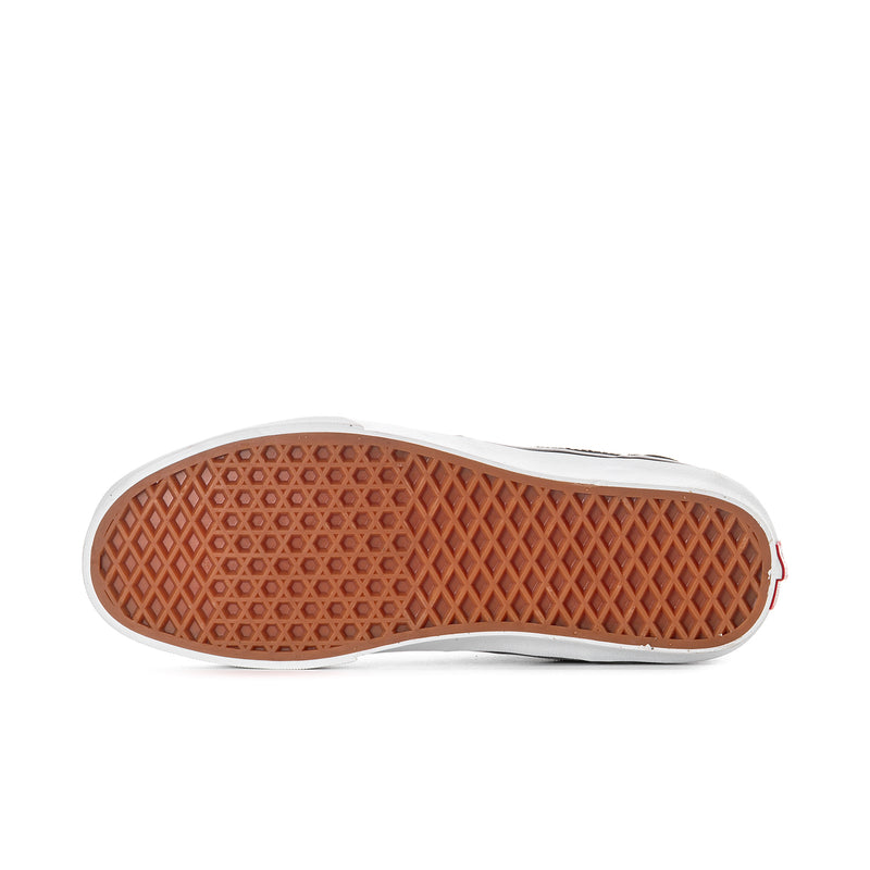 Black high-top sneaker outsole with brown textured tread and white rubber edge