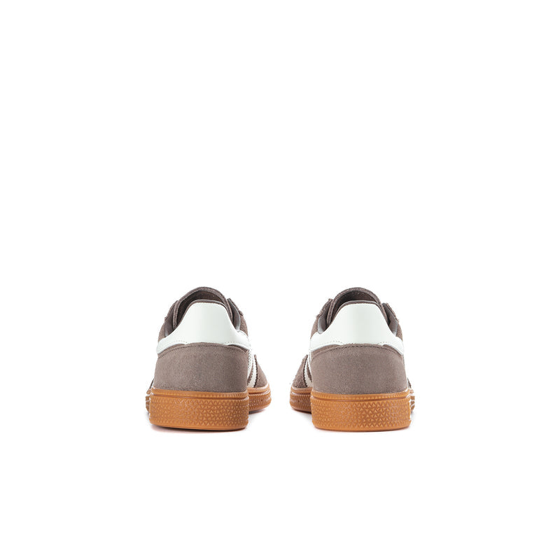 Kids sneakers heel view, brown suede with white collar and gum rubber outsole