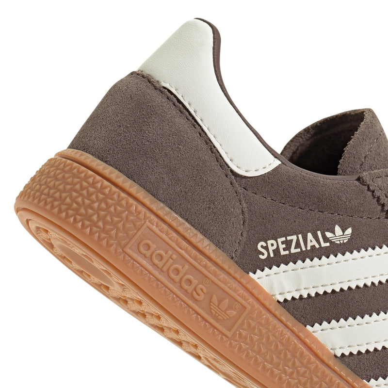 Kids sneaker side close-up with SPEZIAL branding and gum sole