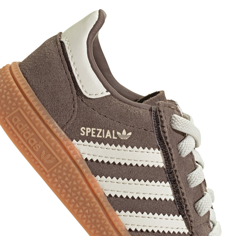 Toddler shoe upper close-up: brown suede, SPEZIAL logo, cream stripes, white laces