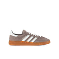 Youth suede sneakers in brown with cream stripes and orange gum sole.